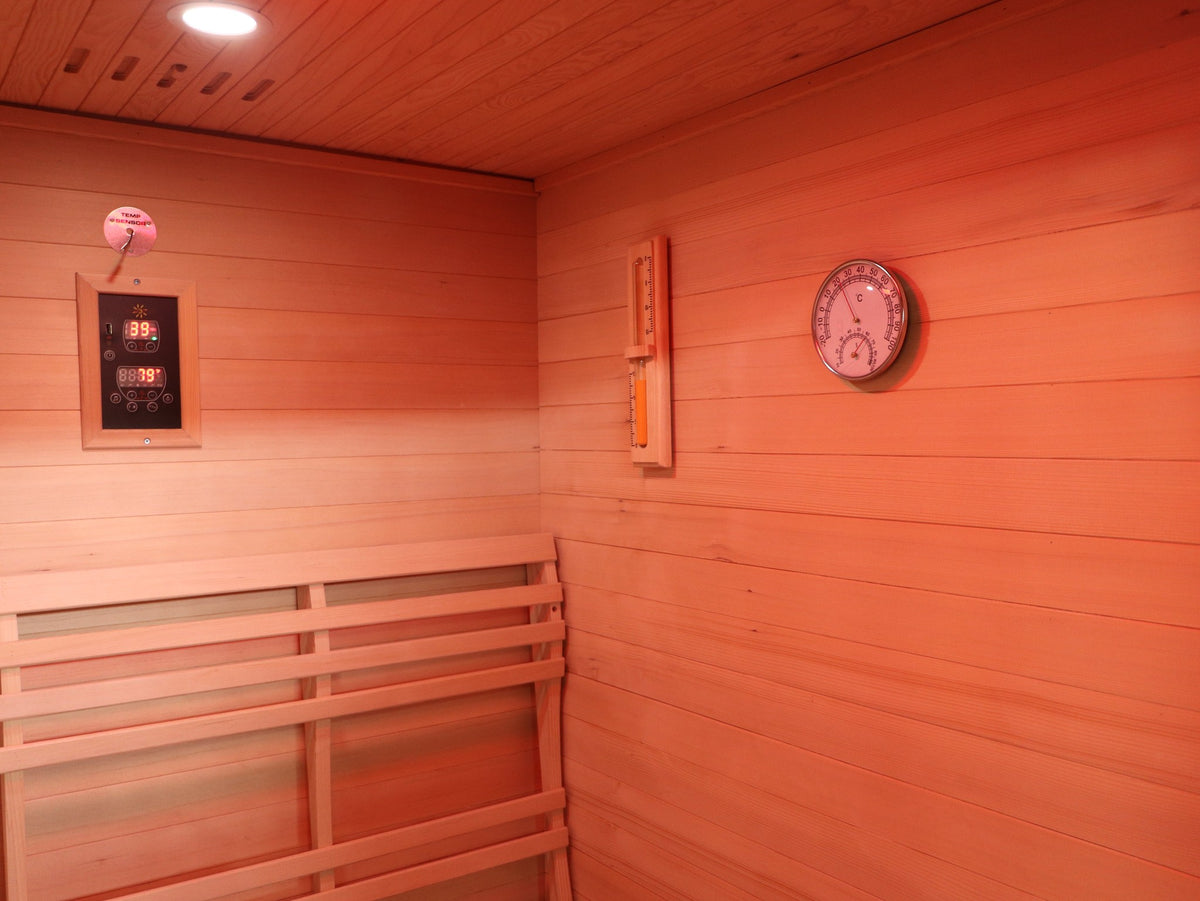 Corner inside the SunRay Waverly with the control panel, sand timer, hygrometer and backrest (interior shared with the Freeport)