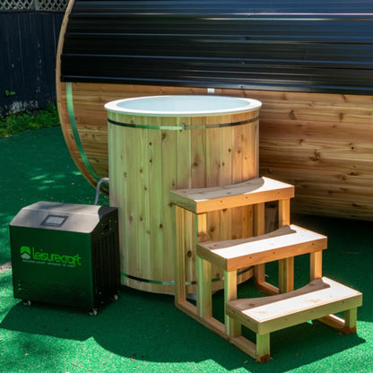 The Baltic Plunge Tub on artificial turf with three-tier cedar steps and a LeisureCraft chiller alongside