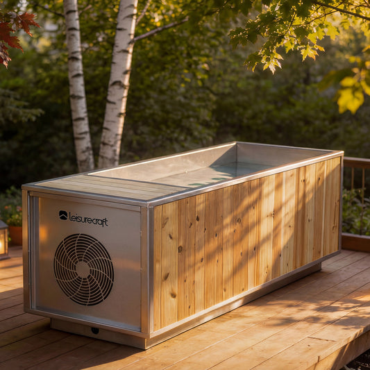 The Flow Cold Plunge by LeisureCraft in knotty cedar on a wooded backyard deck, chiller vent panel facing the camera