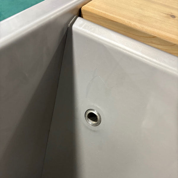 Interior of The Flow Cold Plunge, stainless steel liner with water inlet fitting under the cedar top rail