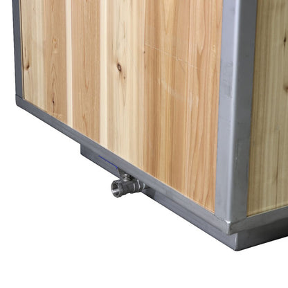 Drain fitting at the base of The Flow Cold Plunge with knotty cedar cladding above