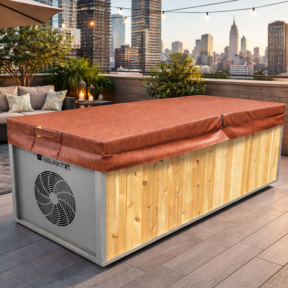 The Flow Cold Plunge with its insulated vinyl cover fitted, rooftop terrace with skyline behind