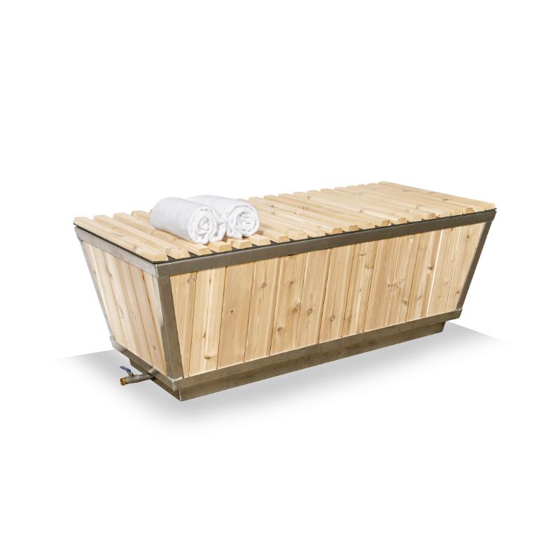 The Polar Plunge Tub on white with cedar roll-up cover closed, rolled towels on top and drain valve below
