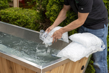 Adding bagged ice to The Polar Plunge Tub during setup