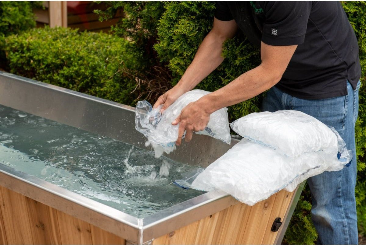 Adding bagged ice to The Polar Plunge Tub during setup