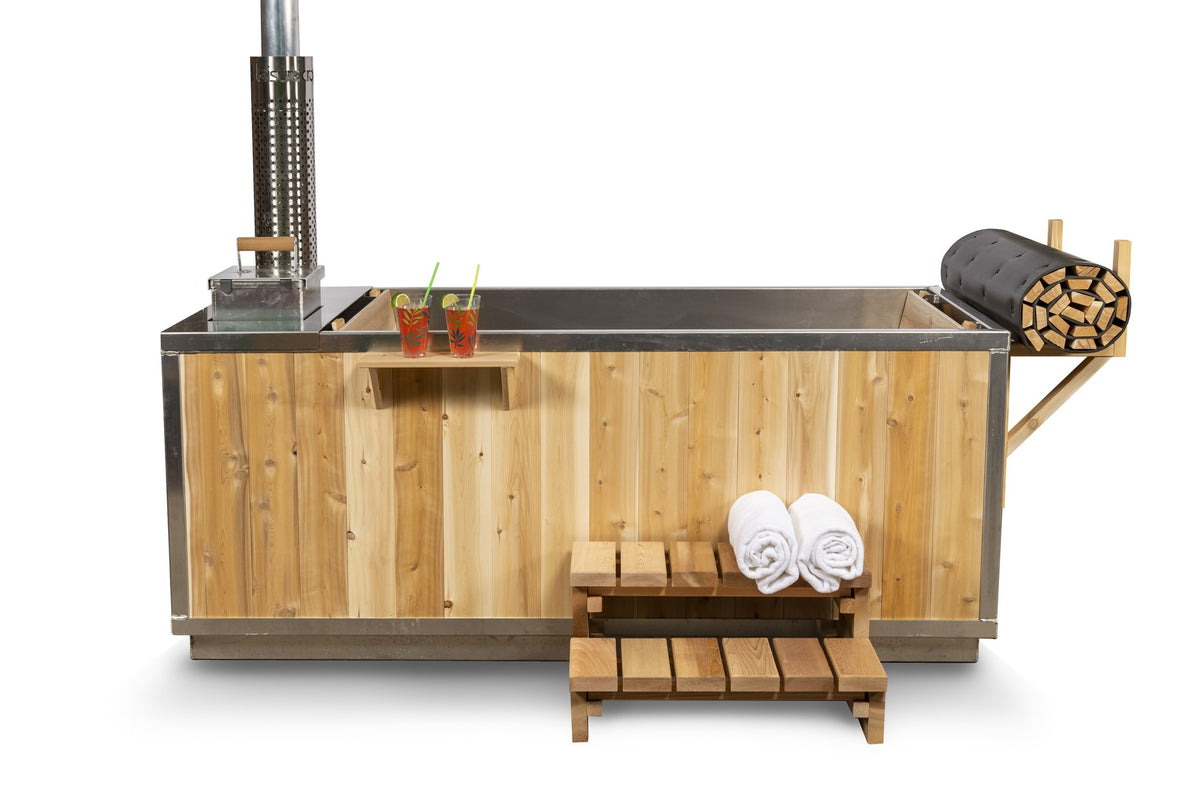 Straight side view of the Starlight hot tub, the full length of its vertical white cedar skirt, chimney at the left, roll-up cover at the right.